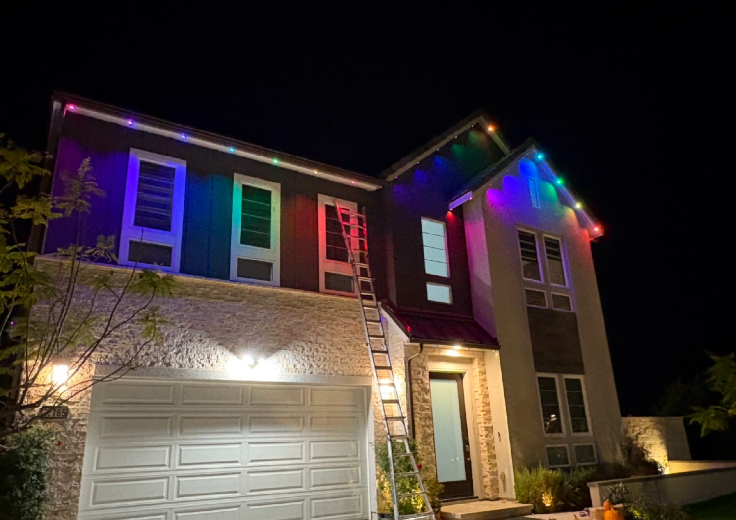 Two-story home with rainbow LED roofline